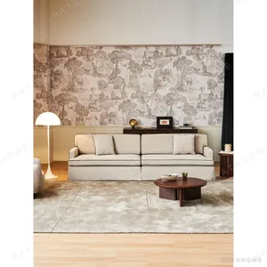 Souffle Slipcovered Sofa in olive — in a room setting