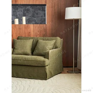 Souffle Slipcovered Sofa in olive — in a room setting