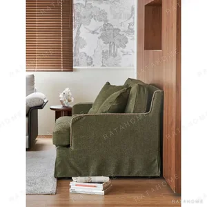 Souffle Slipcovered Sofa in olive — in a room setting