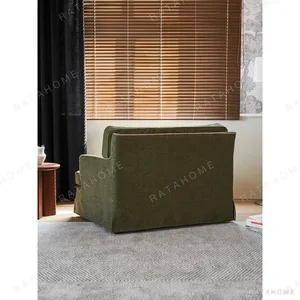 Souffle Slipcovered Sofa in olive — in a room setting