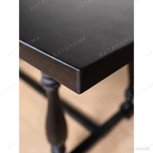 Spindle Black Long Table with Turned Legs and Stretcher in black — in a room setting