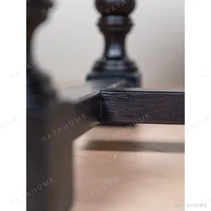 Spindle Black Long Table with Turned Legs and Stretcher in black — in a room setting