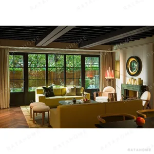 Spring Yellow Curved Sofa with Oak Frame Furniture in mustard — in a room setting