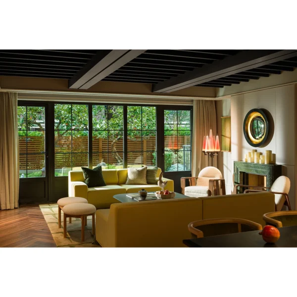 Spring Yellow Curved Sofa with Oak Frame Furniture in mustard — in a room setting