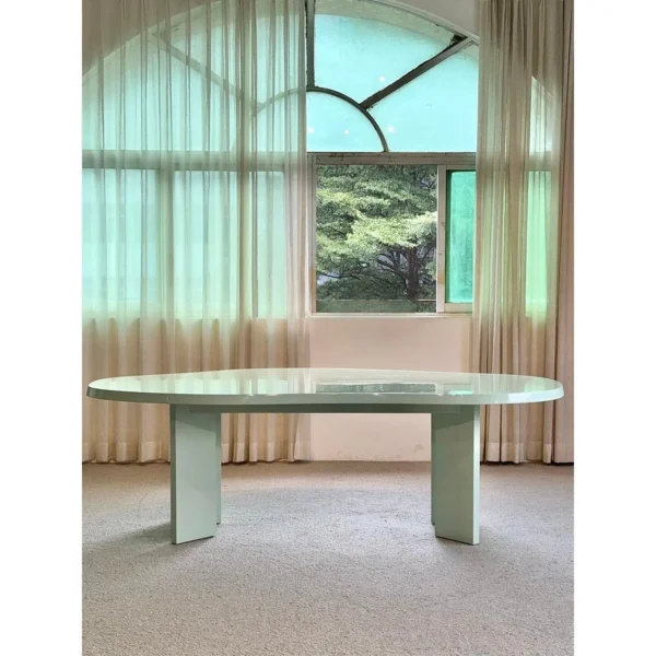 Spring Mist Green Cloud-Shaped Dining Table in olive — in a room setting