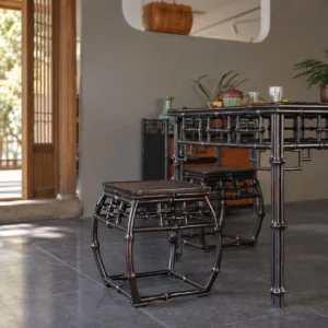 Square Dark Bamboo Stool with Woven Top and Lattice Apron in black — in a room setting