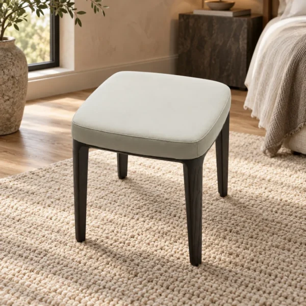 Pale Grey Upholstered Stool in slate — in a room setting