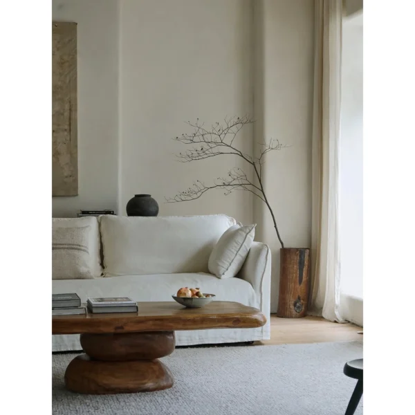 Pebble Stacked Wood Coffee Table in clay — in a room setting