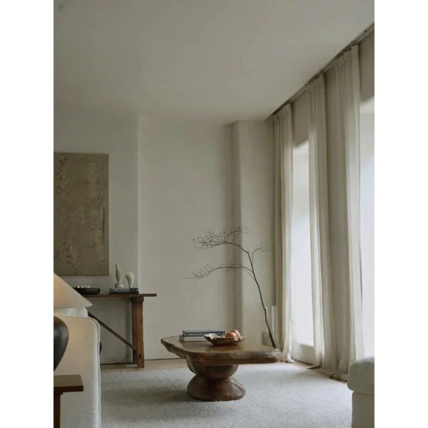 Pebble Stacked Wood Coffee Table in clay — in a room setting