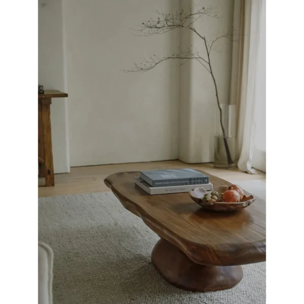 Pebble Stacked Wood Coffee Table in clay — in a room setting