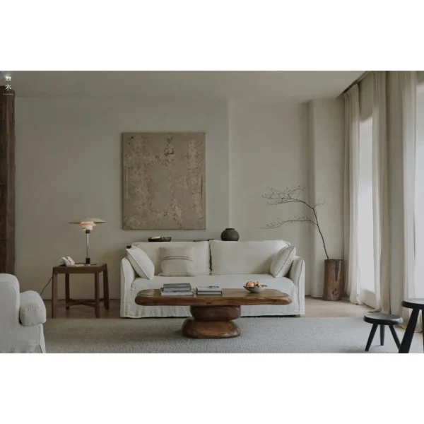 Pebble Stacked Wood Coffee Table in clay — in a room setting