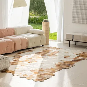 Stain-Resistant Hexagon Cowhide Rug in Caramel and Cream — in a room setting