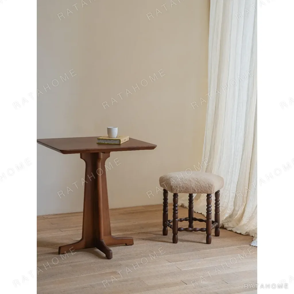 Star Shearling Stool with Turned Dark Wood Legs in oatmeal — in a room setting