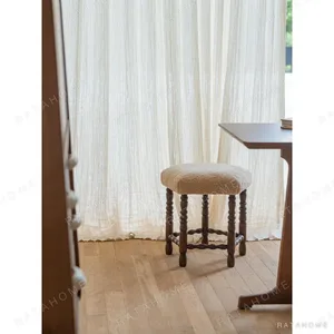 Star Shearling Stool with Turned Dark Wood Legs in oatmeal — in a room setting