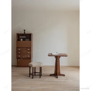 Star Shearling Stool with Turned Dark Wood Legs in oatmeal — in a room setting