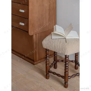 Star Shearling Stool with Turned Dark Wood Legs in oatmeal — in a room setting
