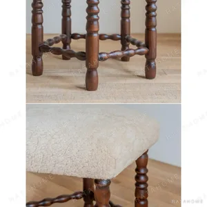 Star Shearling Stool with Turned Dark Wood Legs in oatmeal — in a room setting