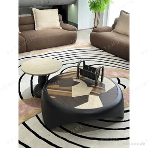 Starry Black Round Coffee Table Pair with Marquetry Top in black — in a room setting