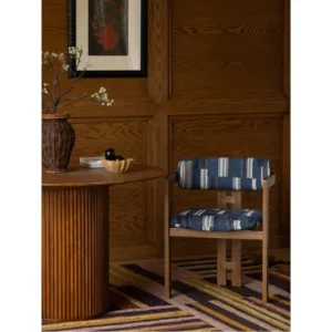 Starry Ash Dining Armchair in natural oak — in a room setting