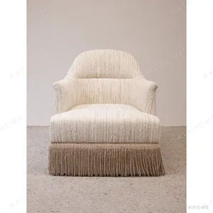 Fringed Cotton-Linen Slipper Chair in oatmeal — in a room setting