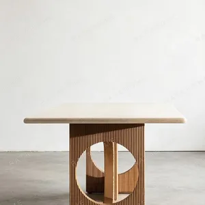Solid Wood Dining Table with Arched Cut-Out Bases in natural oak — in a room setting