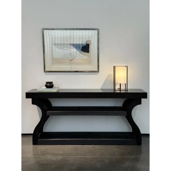 Volu Black Wood Console with Sculpted Side Supports in black — in a room setting