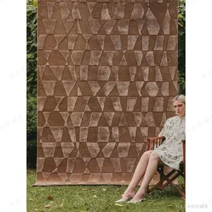Caramel Geometric Facet Rug in clay — in a room setting