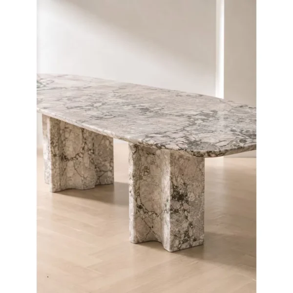 Four Seasons Pink-Green Stone Dining Table on Slab Legs in rose stone — in a room setting