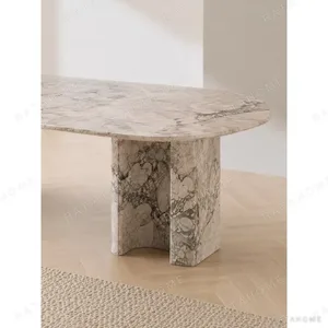 Four Seasons Pink-Green Stone Dining Table on Slab Legs in rose stone — in a room setting