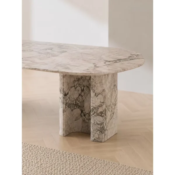 Four Seasons Pink-Green Stone Dining Table on Slab Legs in rose stone — in a room setting