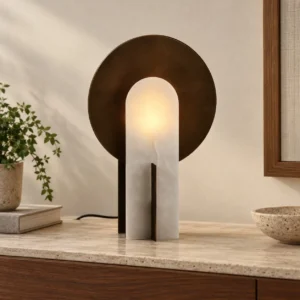Stone Arch Table Lamp with Black Metal Disc in sand — front view