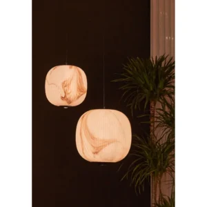 Stone-Pattern Long Oval Pendant Light, 25 cm in ivory — in a room setting