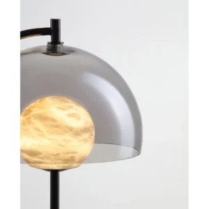 Marbled Globe Table Lamp with Smoked Glass Half Shade in black — in a room setting