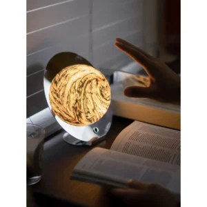 Marbled Half Moon Disc Table Lamp on Low Chrome Base in silver — in a room setting