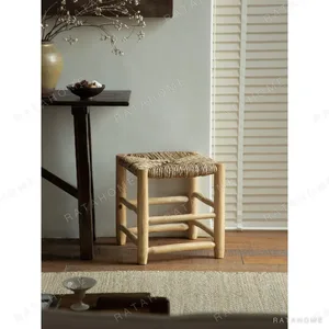 Straw Woven Bench with Turned Wood Legs in sand — in a room setting