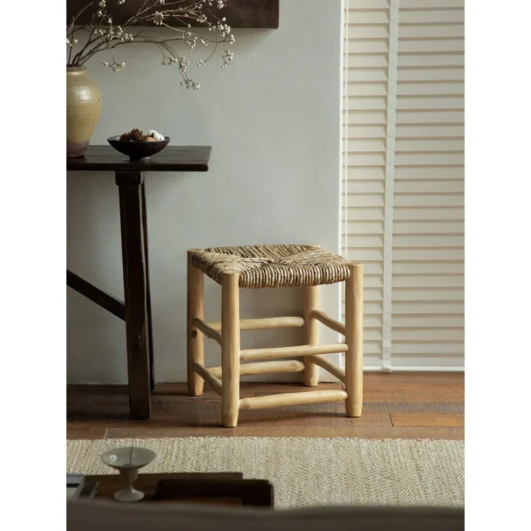 Straw Woven Bench with Turned Wood Legs in sand — in a room setting