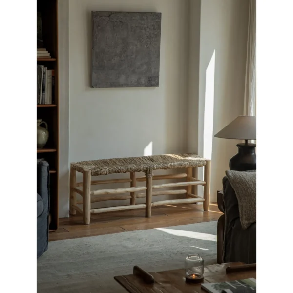 Straw Woven Bench with Turned Wood Legs in sand — in a room setting
