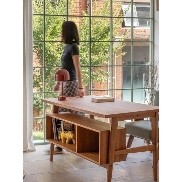 Solid Wood Writing Desk with Open Storage Cabinet in natural oak — in a room setting
