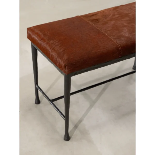 Sud Hair-on-Hide Leather Bench with Forged Copper Legs in clay — in a room setting