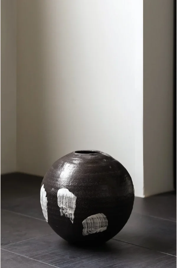 Artist Collaboration Black Brushed Moon Jar in black — in a room setting