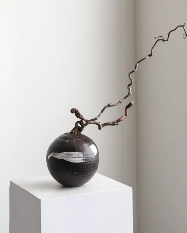 Artist Collaboration Black Brushed Moon Jar in black — in a room setting