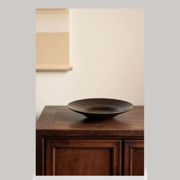Artist Collaboration Dark Brown Swirl Glazed Ceramic Plate in clay — in a room setting