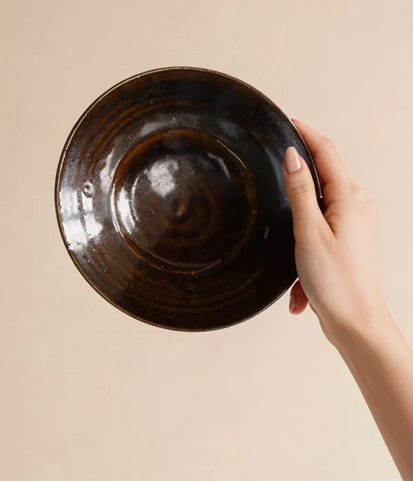 Artist Collaboration Dark Brown Swirl Glazed Ceramic Plate in clay — in a room setting