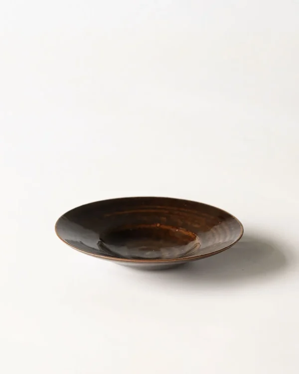 Artist Collaboration Dark Brown Swirl Glazed Ceramic Plate in clay — in a room setting