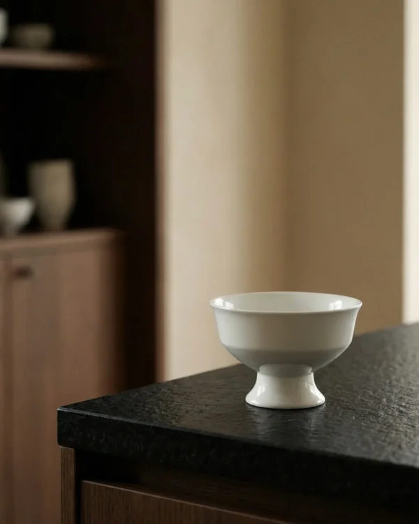 Artist Collaboration White Footed Dessert Cup in ivory — in a room setting