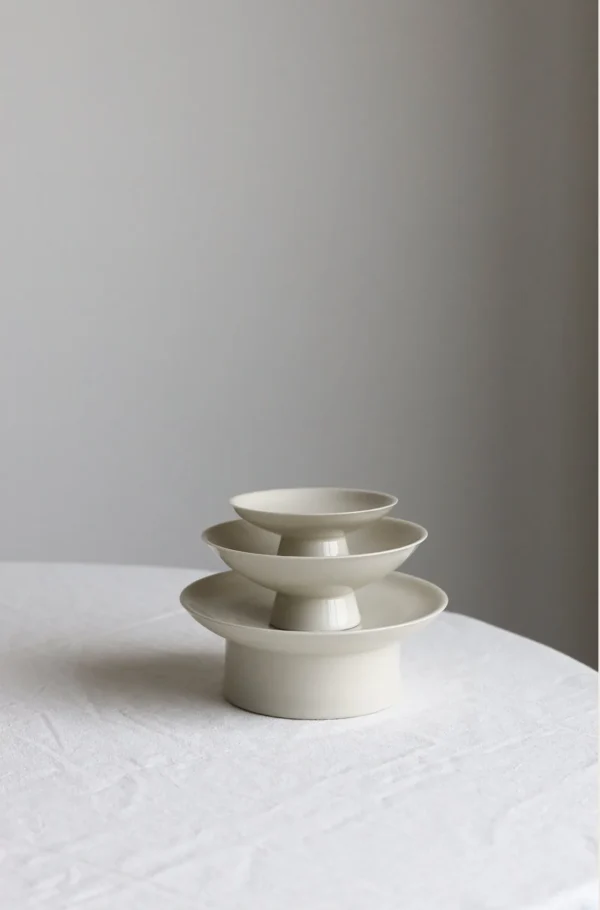 Artist Collaboration Footed Tea Snack Plates in ivory — in a room setting