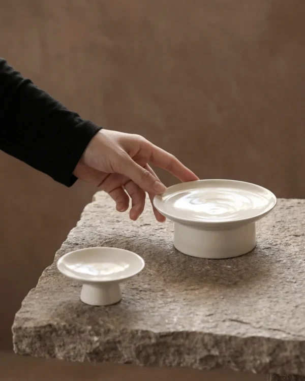 Artist Collaboration Footed Tea Snack Plates in ivory — in a room setting