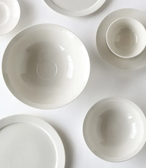 Artist Collaboration Flared Ceramic Bowls in Warm White — in a room setting