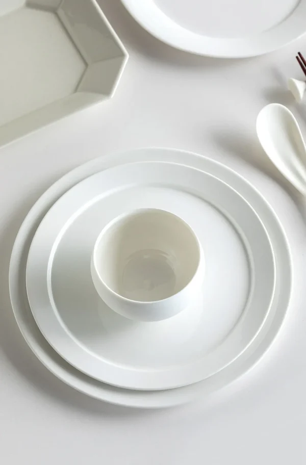 Artist Collaboration Minimalist White Porcelain Wide-Ring in ivory — in a room setting