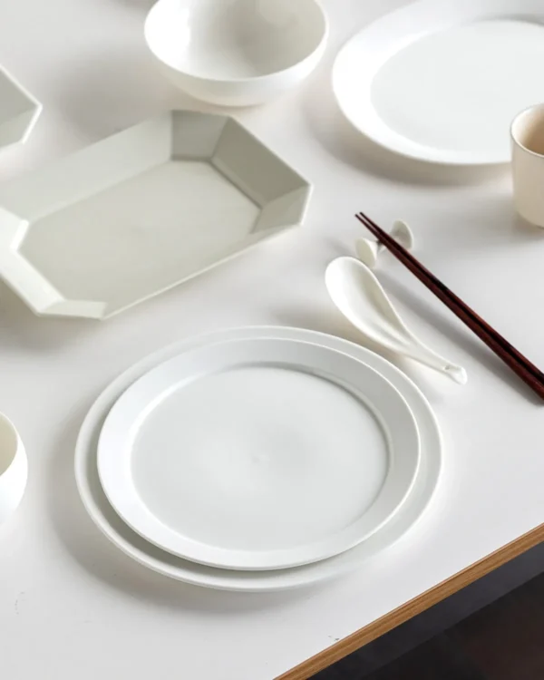 Artist Collaboration Minimalist White Porcelain Wide-Ring in ivory — in a room setting